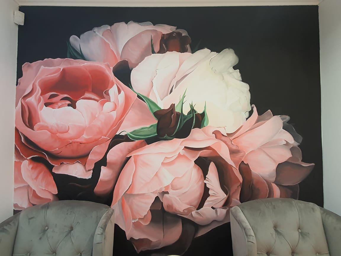 Pink floral feature wall and pedicure seating